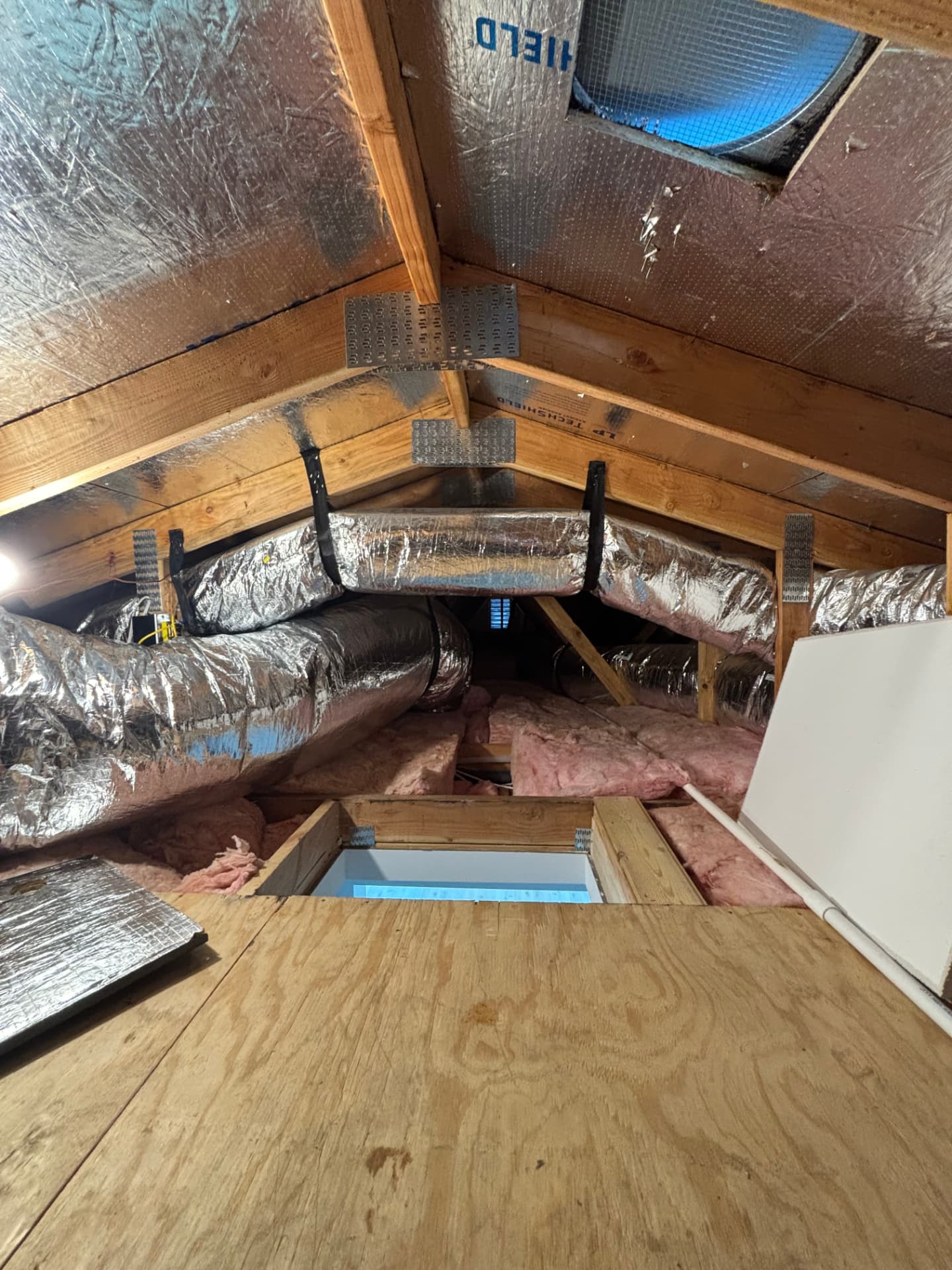 New insulated attic ductwork installed after an HVAC replacement
