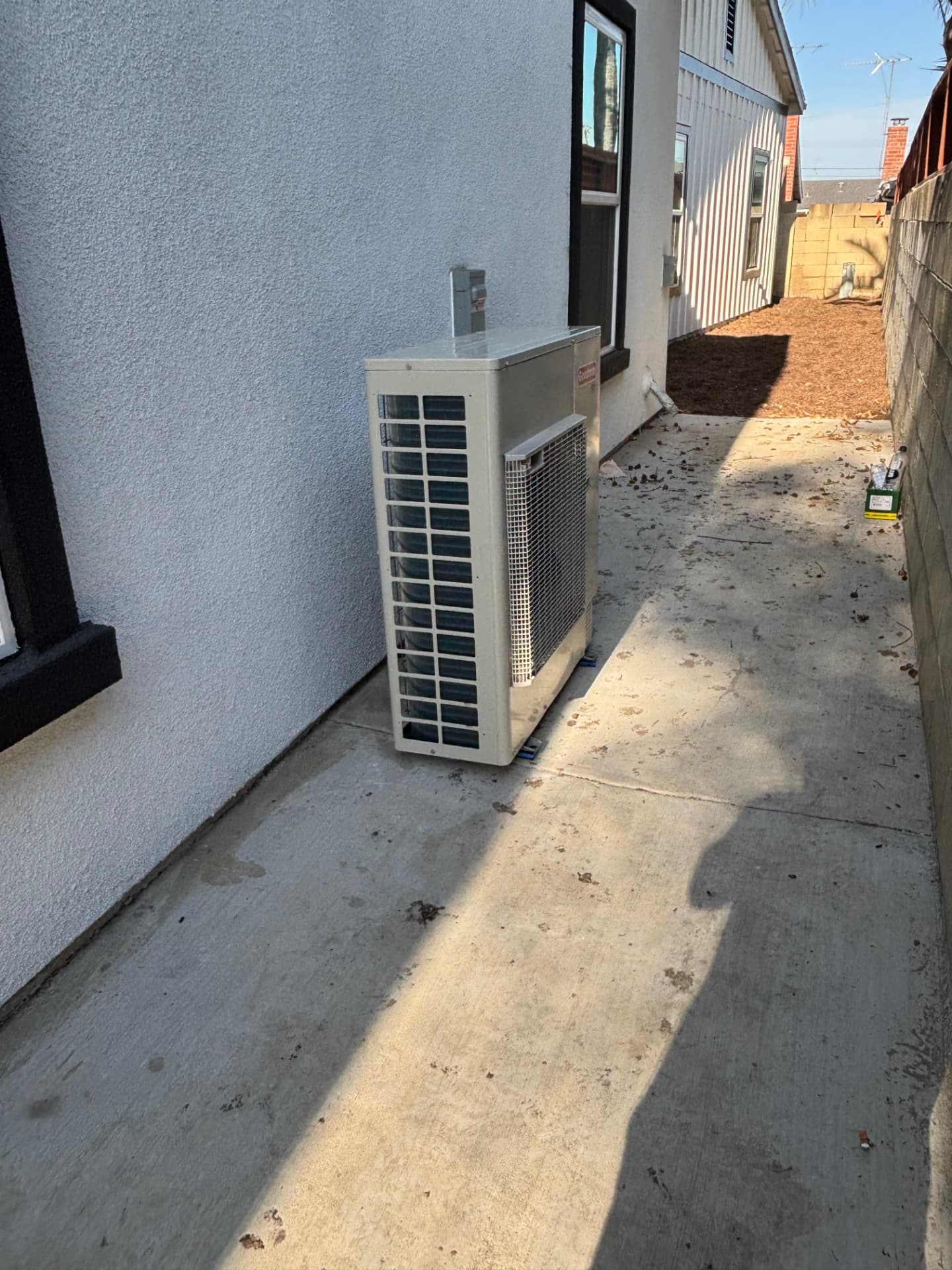 New side-yard condensing unit installation with disconnect box